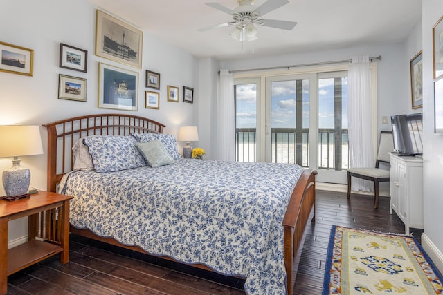 bedroom with access to exterior, dark wood-style flooring, ceiling fan, and baseboards