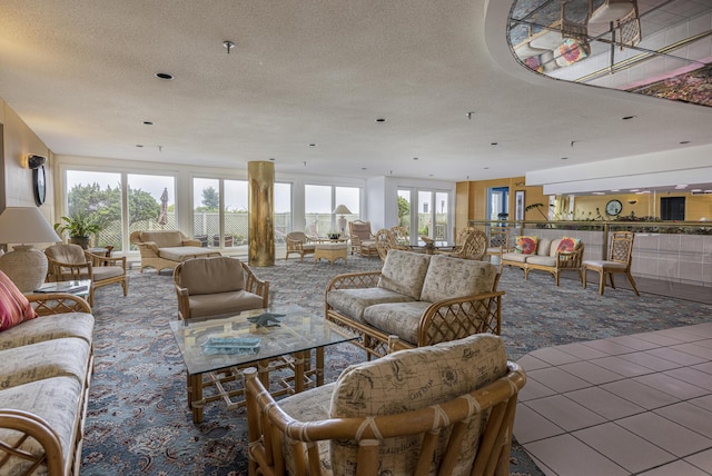 living room with tile patterned flooring and a textured ceiling