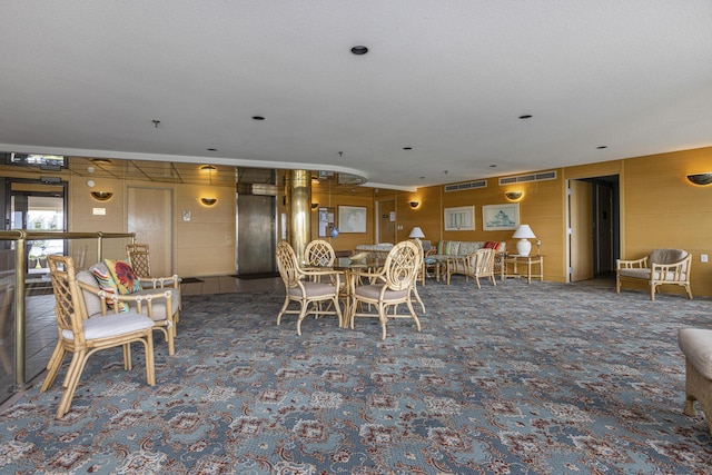 dining space featuring carpet floors and visible vents