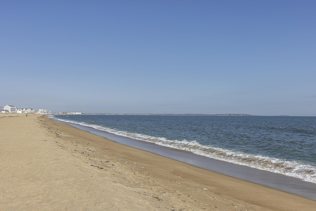 property view of water featuring a beach view