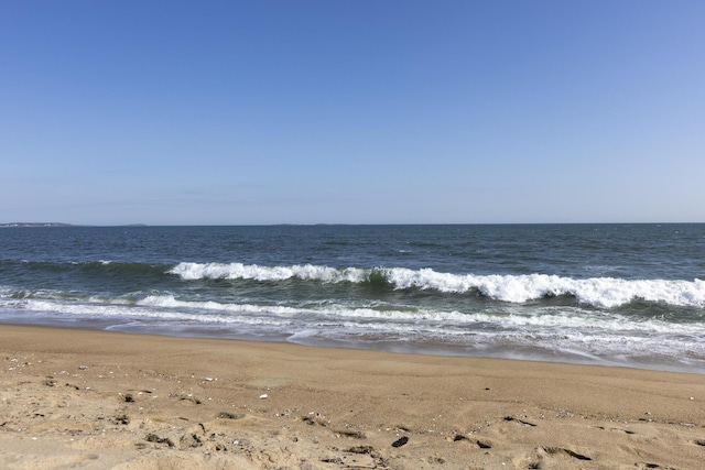 property view of water featuring a beach view