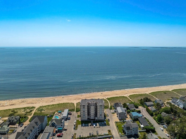 drone / aerial view with a water view and a view of the beach