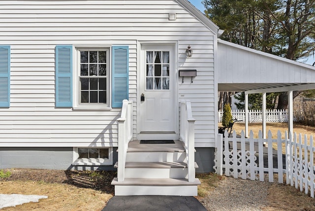 doorway to property with fence