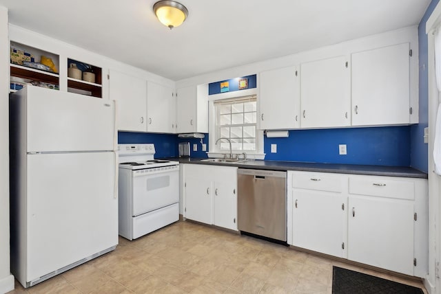 kitchen with a sink, white appliances, dark countertops, and white cabinets