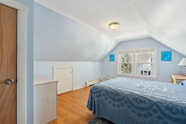 bedroom featuring baseboards, lofted ceiling, light wood-style floors, and baseboard heating