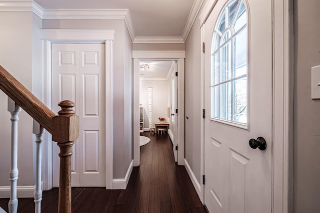 entryway featuring stairway, baseboards, ornamental molding, and dark wood finished floors