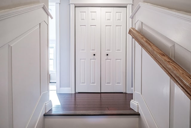 corridor featuring wood finished floors