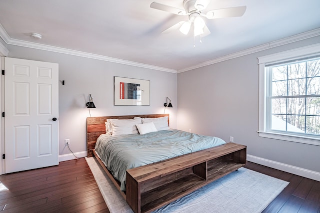 bedroom with a ceiling fan, baseboards, ornamental molding, and dark wood-style flooring