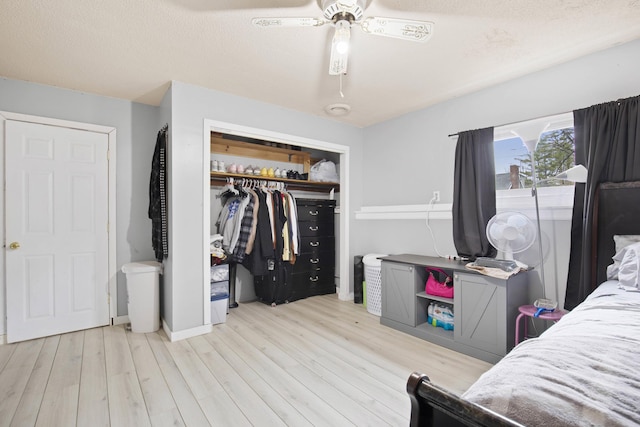 bedroom with a closet, ceiling fan, and wood finished floors