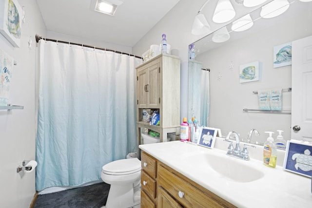 bathroom with vanity, toilet, and a shower with shower curtain