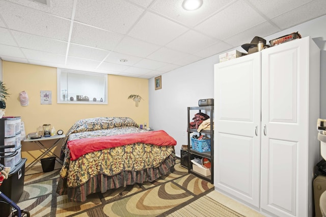 bedroom with a paneled ceiling