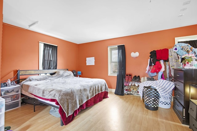 bedroom featuring wood finished floors