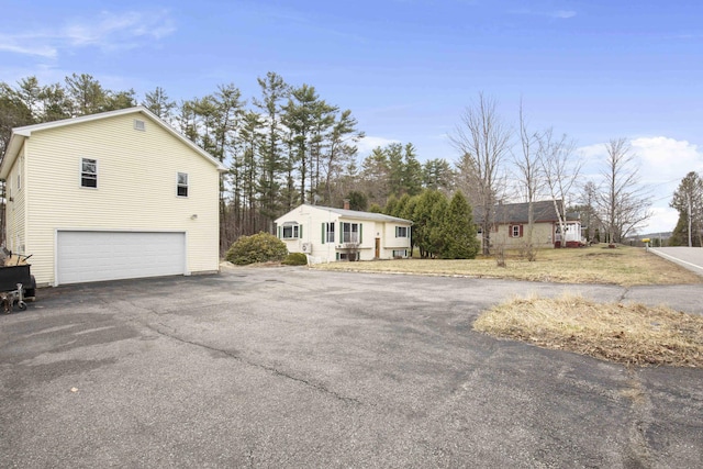 exterior space with driveway and an attached garage
