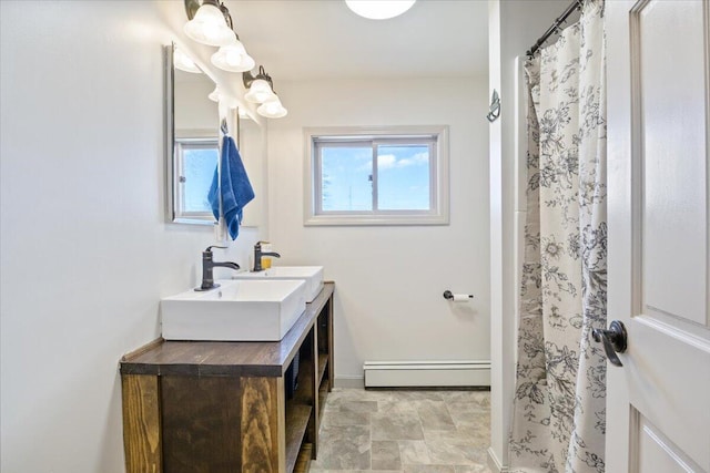 bathroom featuring a shower with curtain, baseboards, baseboard heating, and vanity