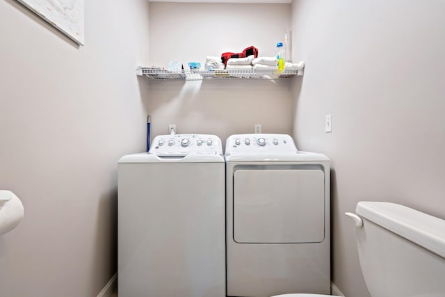 laundry room with laundry area and washer and clothes dryer
