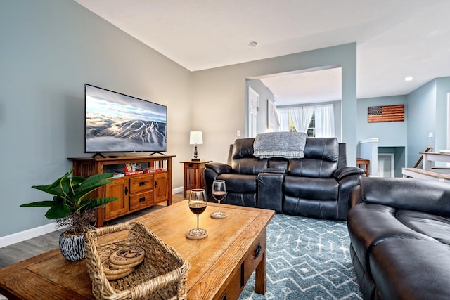 living room featuring wood finished floors and baseboards