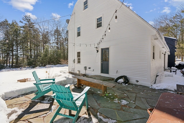 rear view of property featuring a patio