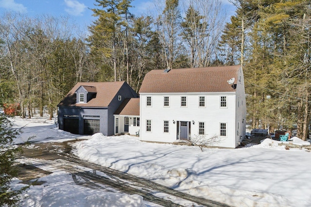 colonial home featuring an attached garage