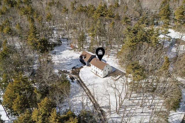 snowy aerial view with a forest view