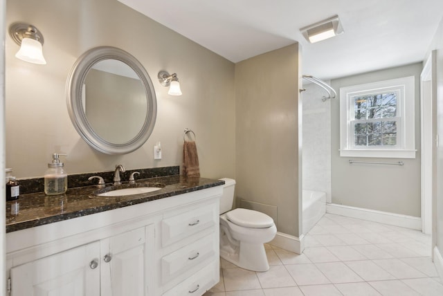 bathroom featuring baseboards, bathing tub / shower combination, toilet, tile patterned floors, and vanity