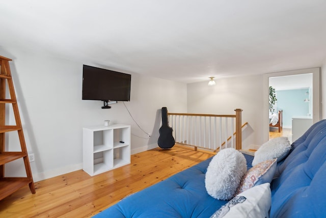 living room featuring baseboards and wood finished floors