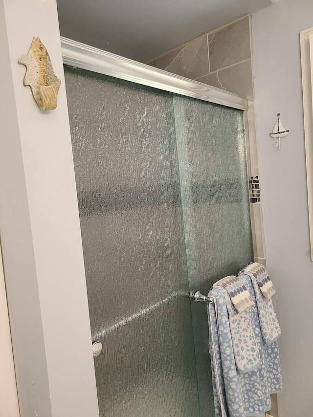 full bath featuring a stall shower