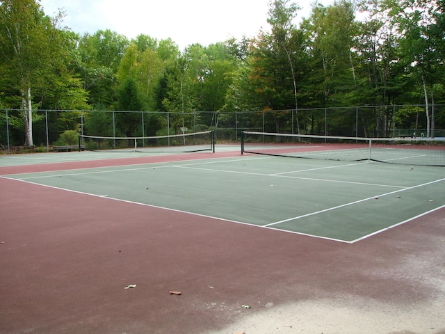 view of sport court with fence