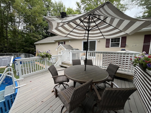 wooden terrace featuring outdoor dining space