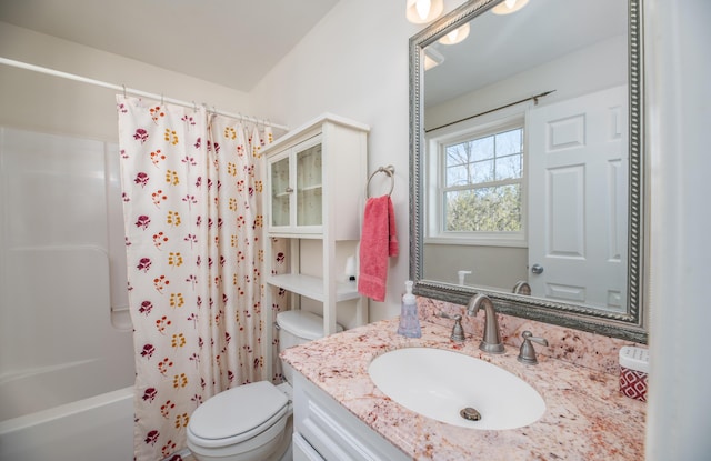 full bathroom with vanity, toilet, and shower / tub combo with curtain