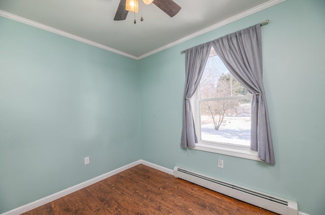 empty room with dark wood-type flooring, ceiling fan, baseboards, ornamental molding, and baseboard heating