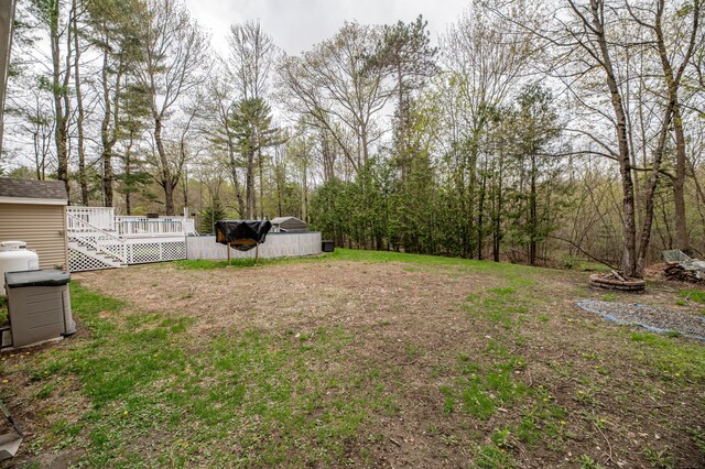 view of yard with a wooden deck