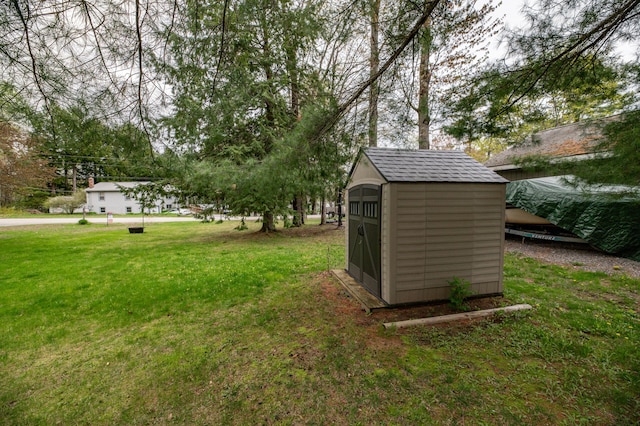 72 Annabessacook Dr, Winthrop, ME 04364 - view of green lawn featuring a storage shed and an outbuilding
