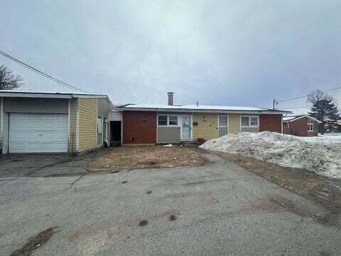 single story home featuring driveway