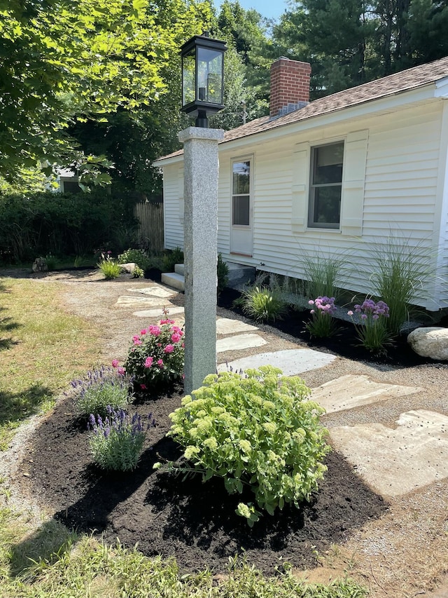 view of side of property with a chimney
