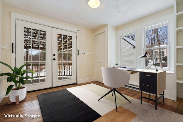 office space with dark wood-style floors, french doors, and a wealth of natural light