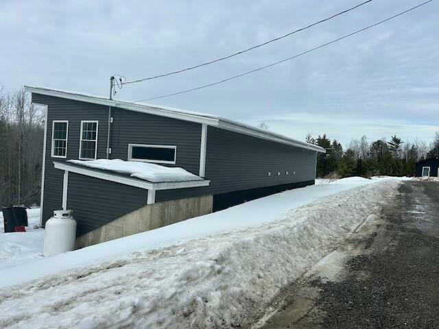 view of snow covered property