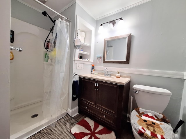 full bath with toilet, a shower stall, crown molding, and vanity