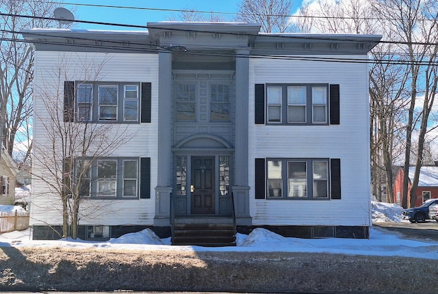 view of front of home featuring fence