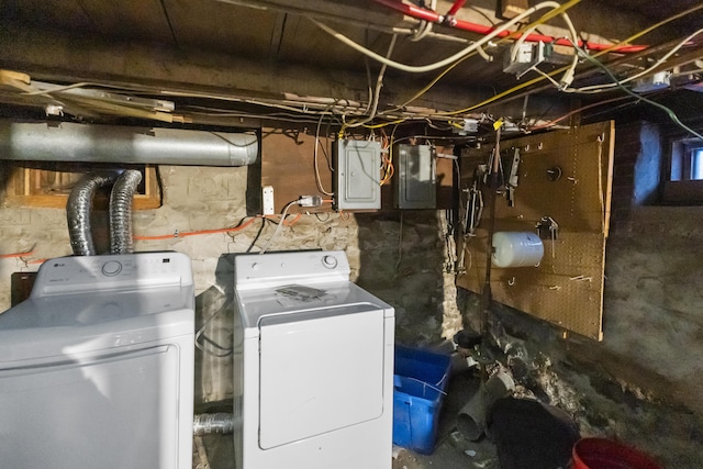 laundry area featuring laundry area, electric panel, and independent washer and dryer