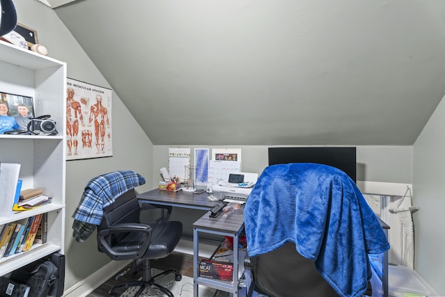 home office with lofted ceiling and baseboards