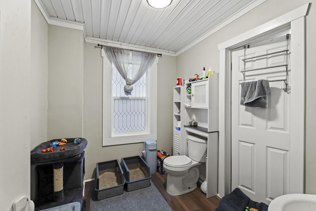 bathroom with toilet, wooden ceiling, ornamental molding, and wood finished floors