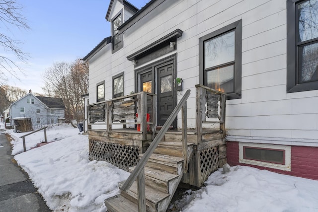 view of snow covered property entrance