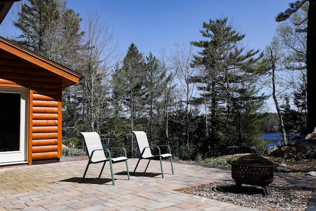 51 Short Point Way, Orland, ME 04472 - view of patio / terrace with a fire pit