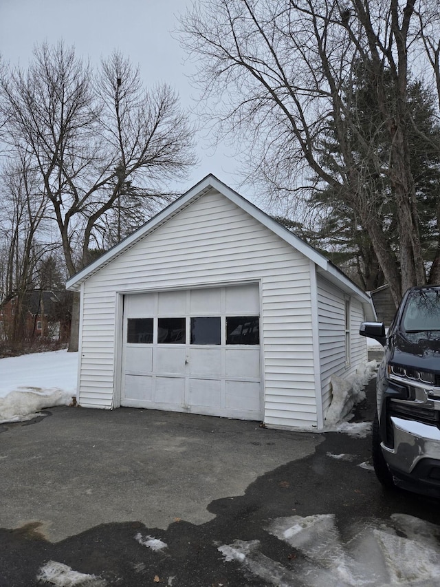 detached garage featuring driveway