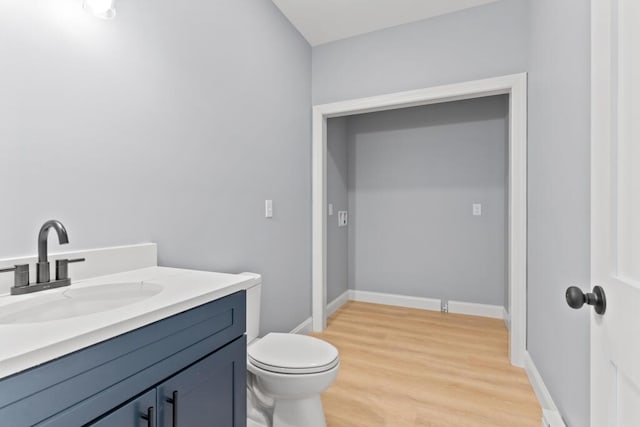7 Parsonage Rd Unit 5, North Yarmouth, ME 04097 - bathroom featuring toilet, wood finished floors, vanity, and baseboards