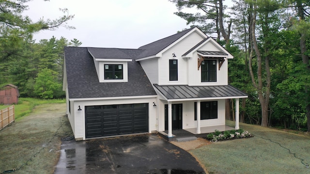 300 N Rd, Yarmouth, ME 04096 - modern farmhouse featuring a porch, driveway, a standing seam roof, a metal roof, and roof with shingles