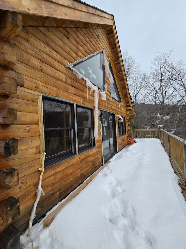 view of side of property with log exterior