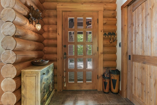 doorway with rustic walls