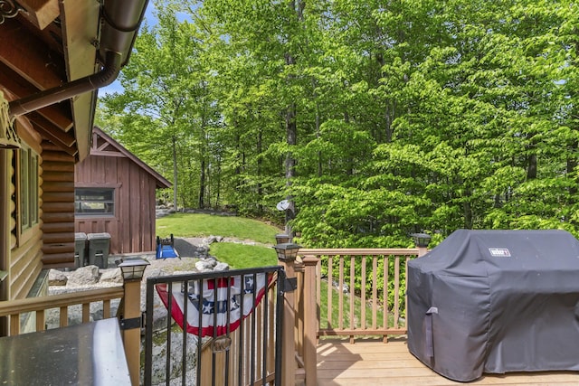 wooden terrace with area for grilling