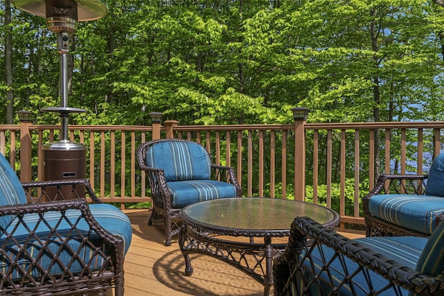 wooden terrace featuring outdoor dining area